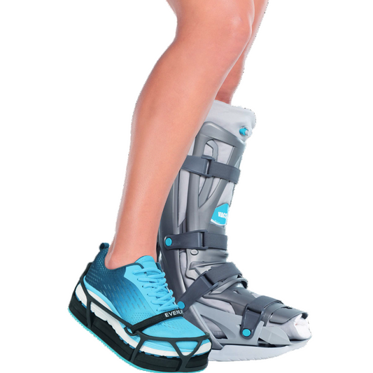 A person wearing a grey and blue EVENup shoe balancer/leveler inside a running shoe.