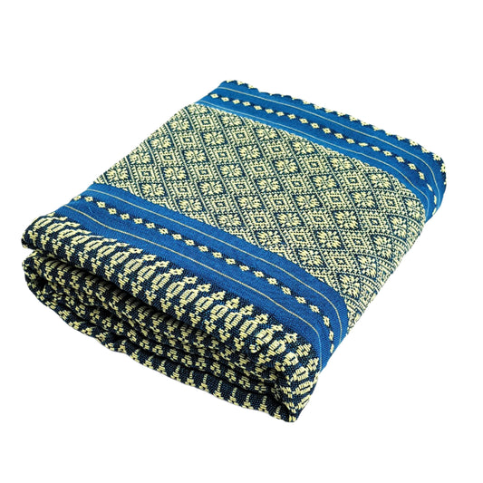Folded fabric with blue and green pattern on a white background, featuring the MangoTrees brand.